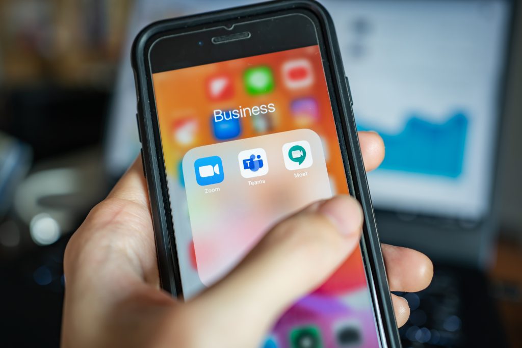 iPhone 7 showing its screen with popular online meeting applications which are Zoom, Microsoft Teams and Hangouts Meet by Google.