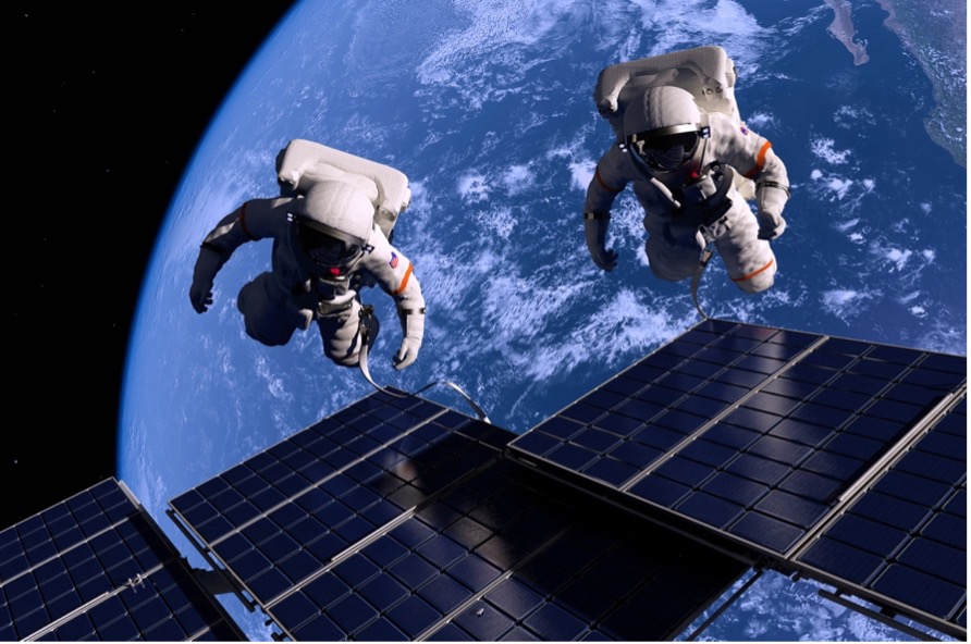 Astronauts in space with solar panels